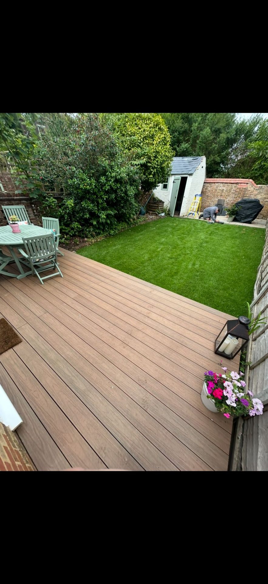 Composite decking with new lawn by Burton Builds landscaping