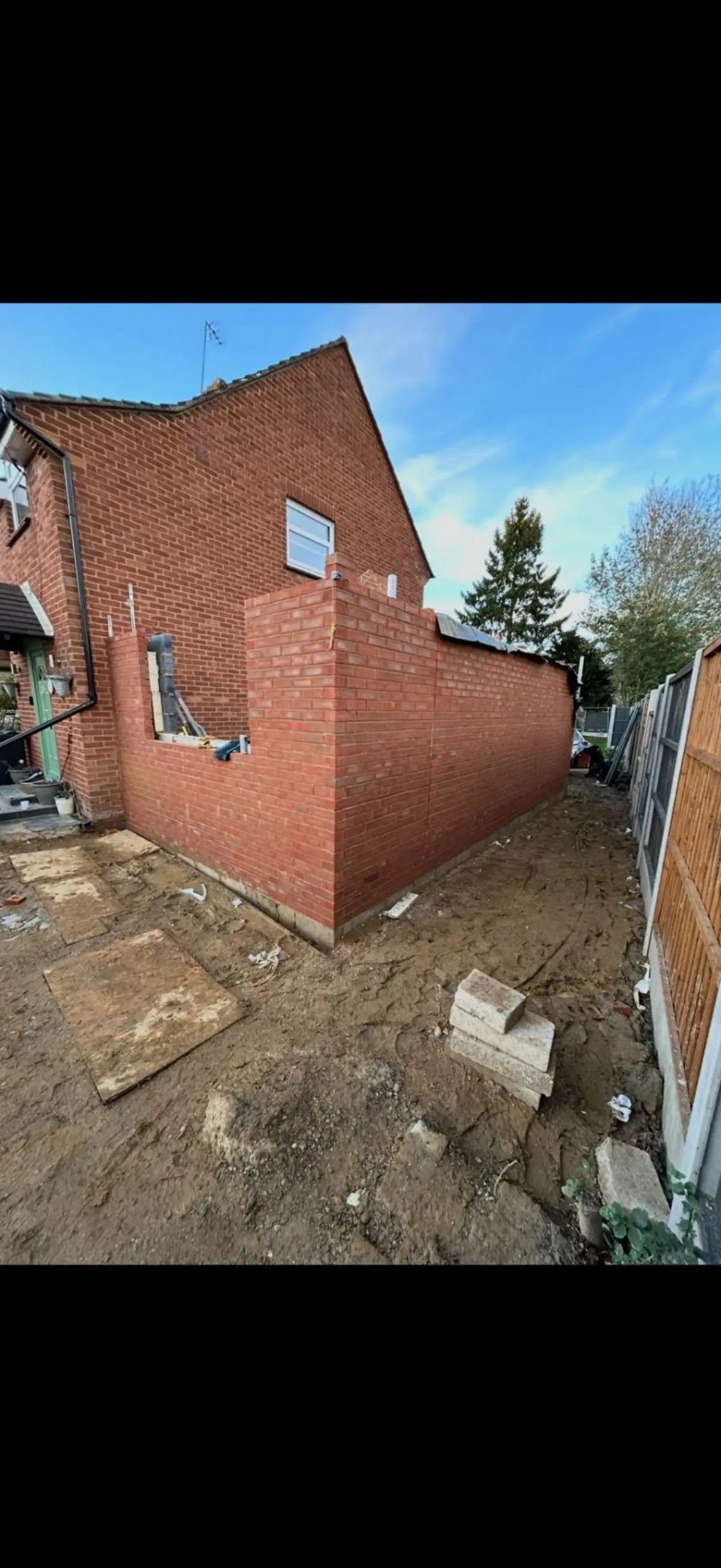 Extension brickwork in progress with structural walls by Burton Builds