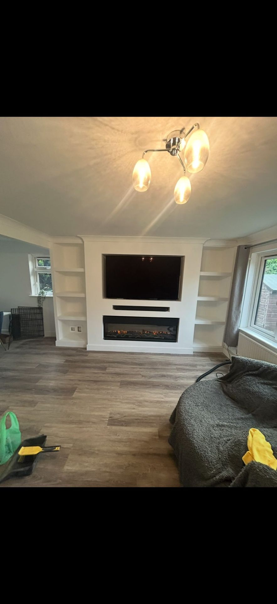 Bespoke media wall with electric fireplace built by Burton Builds carpentry team