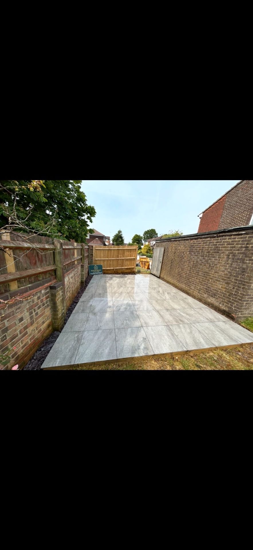 Porcelain patio with new boundary fencing by Burton Builds